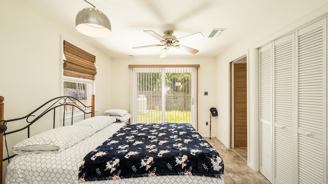 bedroom with access to outside and ceiling fan