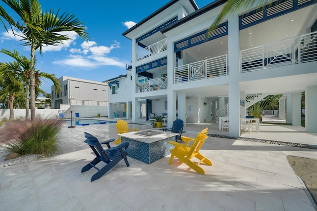 view of patio / terrace with an outdoor fire pit