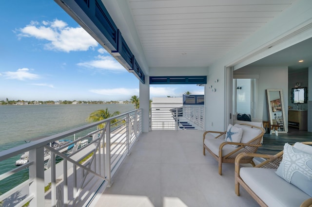 balcony featuring a water view