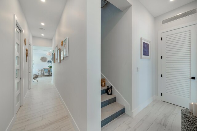 hall with light hardwood / wood-style flooring