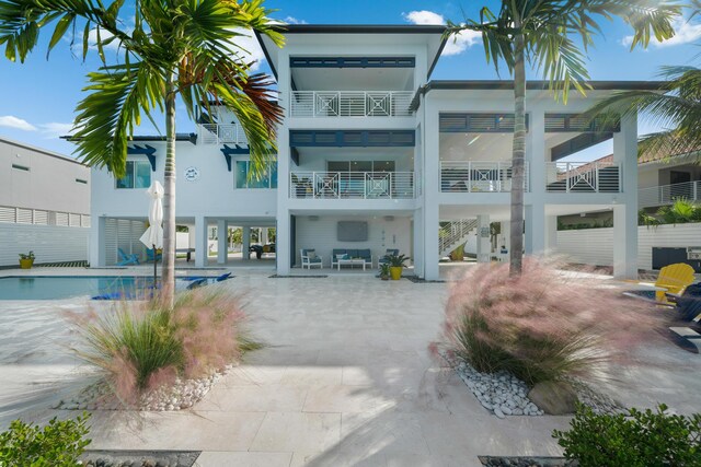 back of house with a patio