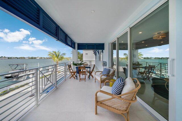 balcony featuring a water view