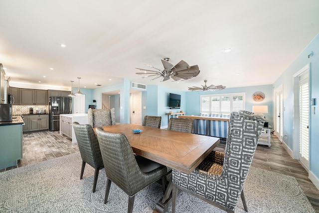 dining space with ceiling fan