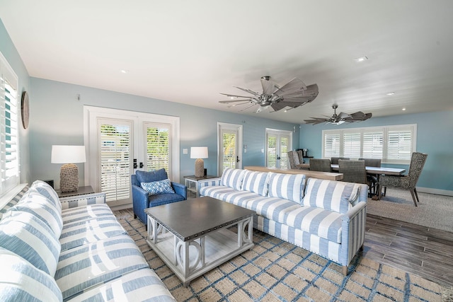 living room featuring french doors, ceiling fan, a healthy amount of sunlight, and hardwood / wood-style floors