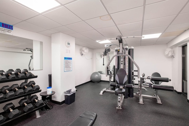 83201 Old Hwy Unit 409, Islamorada, FL 33036 - workout area featuring a paneled ceiling and baseboards