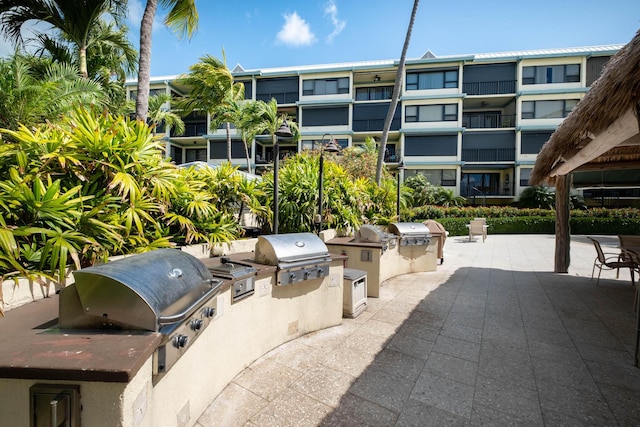 83201 Old Hwy Unit 409, Islamorada, FL 33036 - view of patio / terrace with an outdoor kitchen and area for grilling