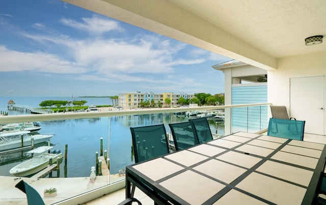 balcony featuring a water view