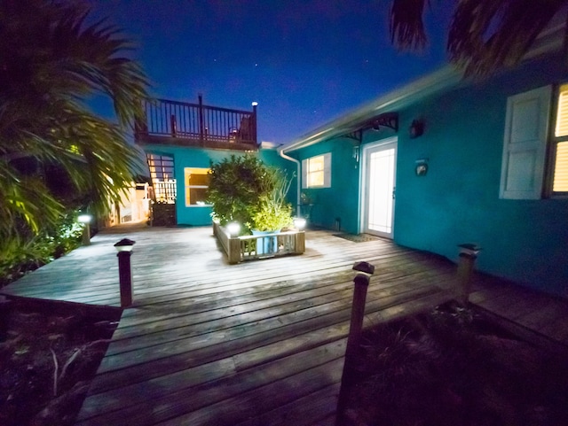 view of deck at twilight