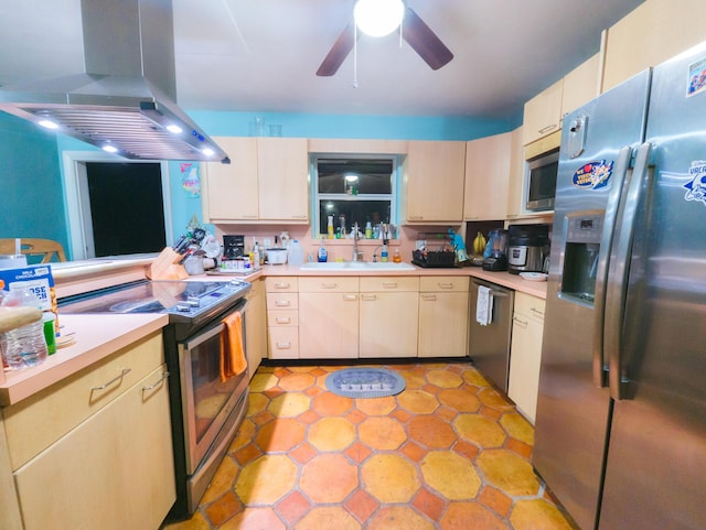 kitchen with ceiling fan, light countertops, appliances with stainless steel finishes, island exhaust hood, and a sink