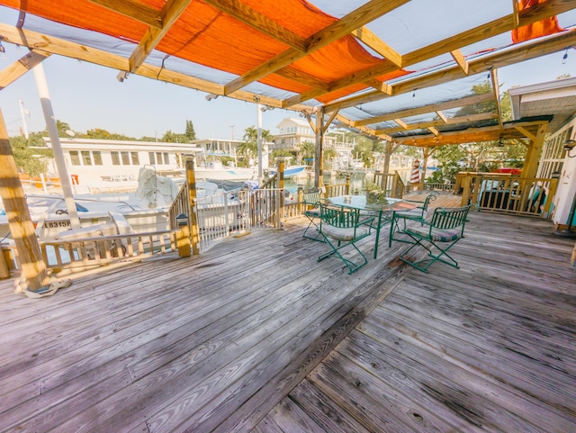 deck featuring boat lift and a dock