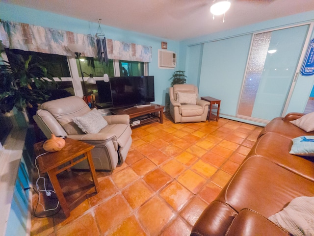 living room with tile patterned flooring and a wall unit AC