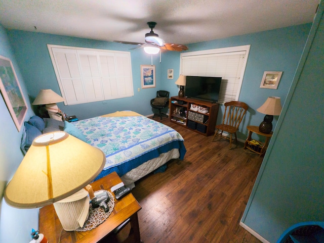 bedroom with ceiling fan and wood finished floors