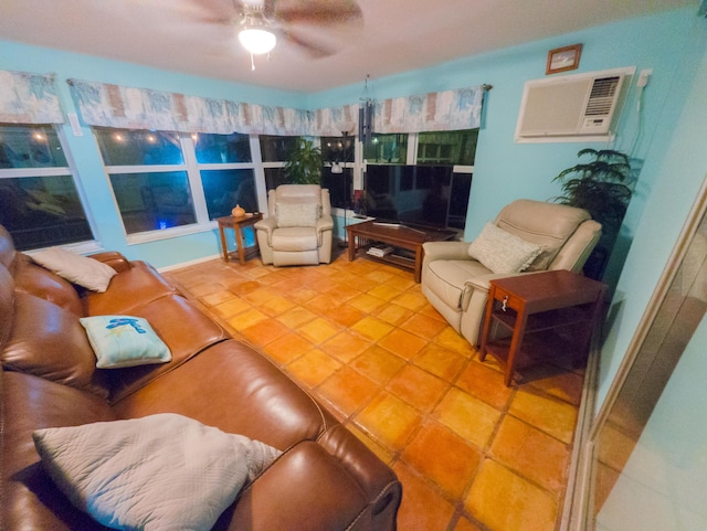 tiled living room with a wall mounted air conditioner and ceiling fan