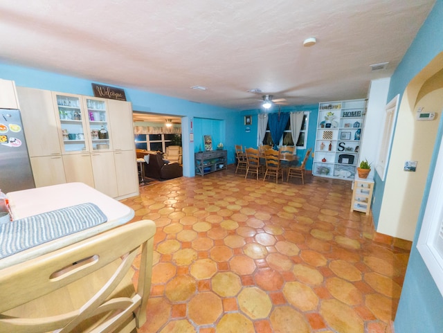 dining space featuring visible vents and a ceiling fan