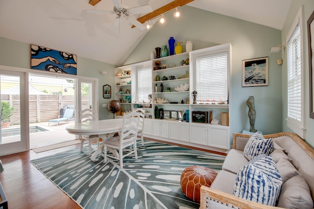 living room featuring hardwood / wood-style flooring, high vaulted ceiling, and ceiling fan