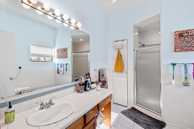 bathroom featuring vanity, an enclosed shower, and tile patterned flooring