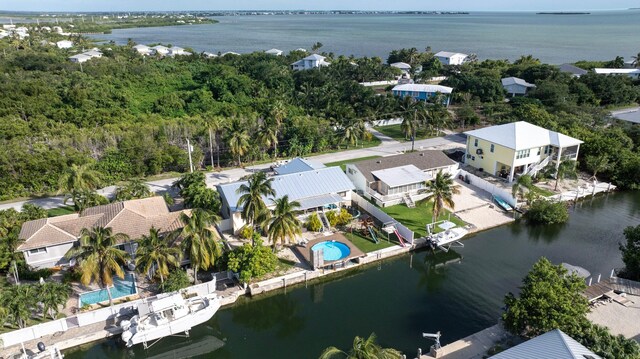 drone / aerial view with a water view