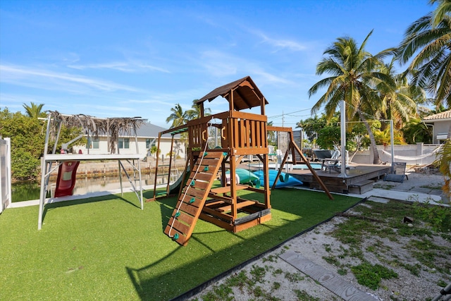 view of jungle gym featuring a water view