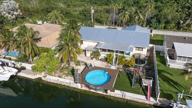 birds eye view of property with a water view