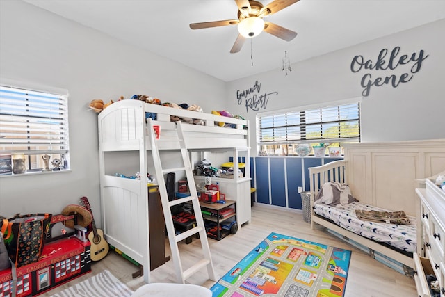 bedroom featuring light hardwood / wood-style flooring and ceiling fan