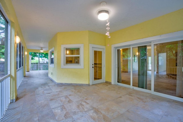 interior space featuring ceiling fan