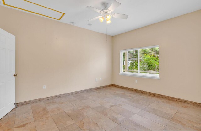 unfurnished room with ceiling fan