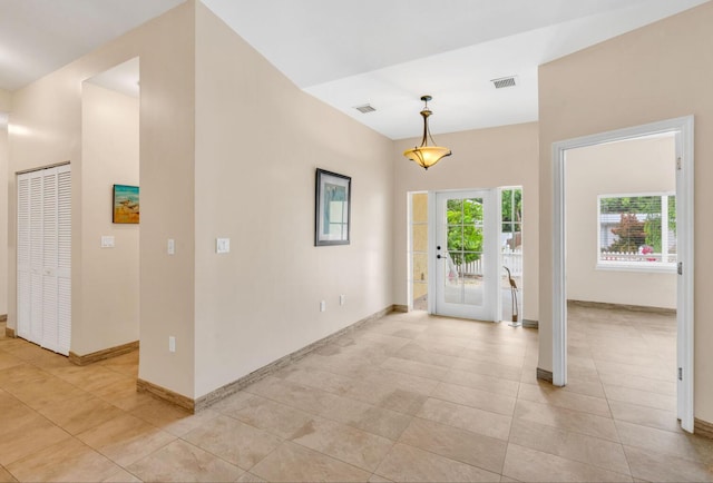 foyer featuring light tile patterned floors