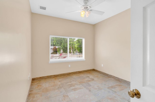 spare room with ceiling fan