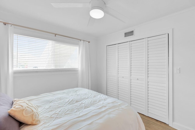 389 N Anglers Dr Unit 101, Marathon, FL 33050 - bedroom with wood finished floors, multiple windows, a closet, and ceiling fan