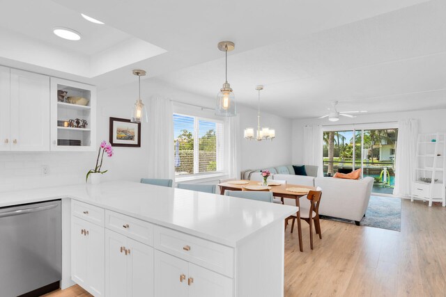 389 N Anglers Dr Unit 101, Marathon, FL 33050 - kitchen with stainless steel dishwasher, healthy amount of natural light, open floor plan, and light wood finished floors
