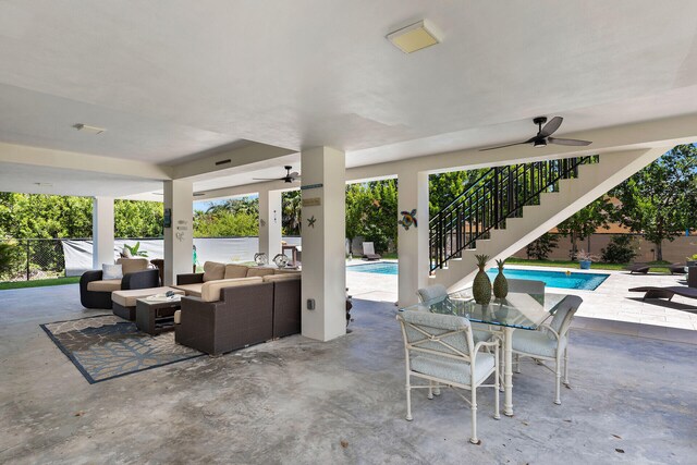 view of patio with a fenced in pool, an outdoor hangout area, and ceiling fan