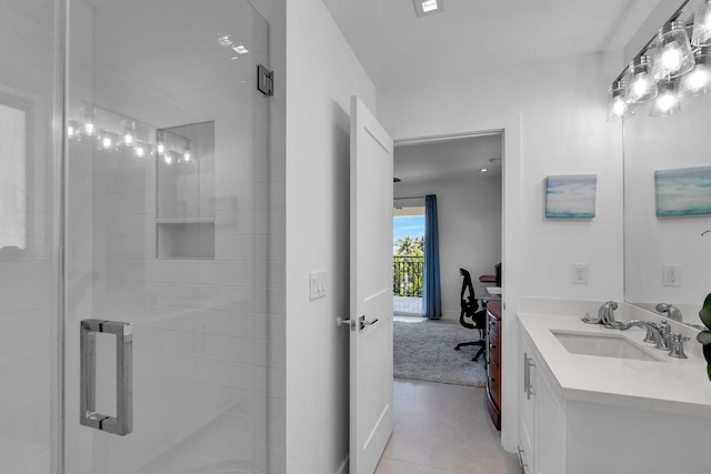 bathroom with walk in shower and vanity