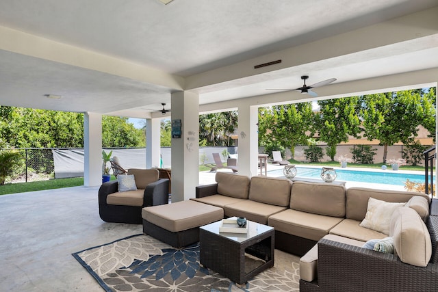 view of patio / terrace featuring ceiling fan, outdoor lounge area, and a fenced in pool