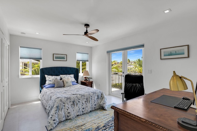 bedroom with multiple windows, access to outside, and ceiling fan