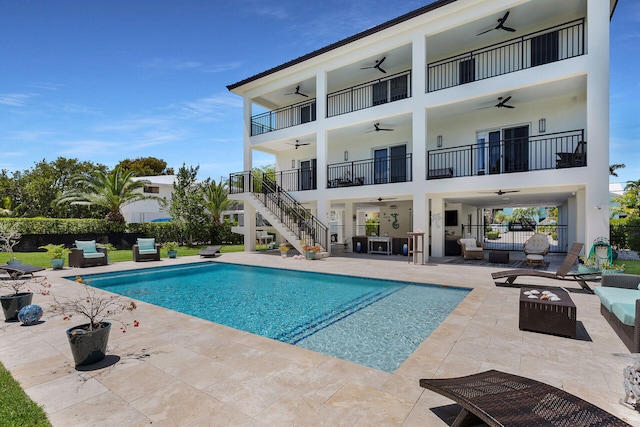 view of swimming pool featuring an outdoor hangout area, ceiling fan, and a patio area