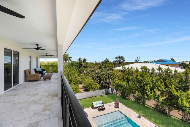 view of swimming pool with a patio area, outdoor lounge area, and ceiling fan