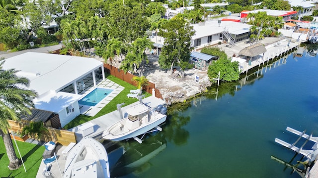 birds eye view of property with a water view