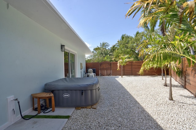 view of patio / terrace featuring a hot tub