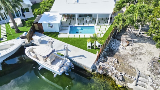 birds eye view of property with a water view