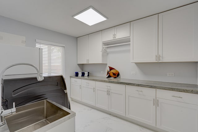 kitchen featuring white cabinetry