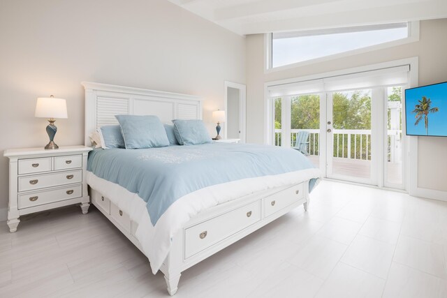 bedroom featuring access to exterior and vaulted ceiling with beams