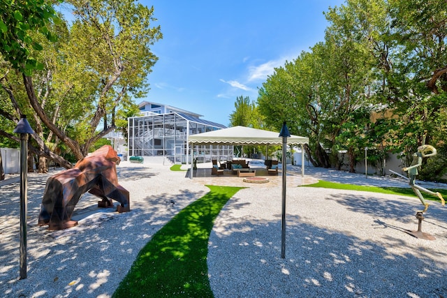 view of community with a gazebo and outdoor lounge area