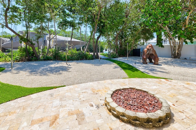 view of yard with a fire pit