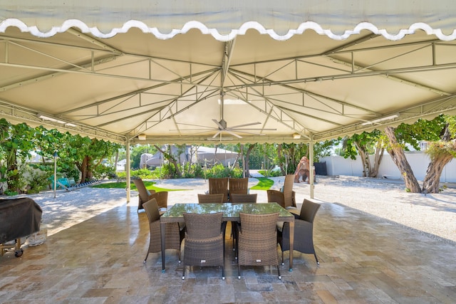 view of patio featuring a gazebo, area for grilling, and ceiling fan