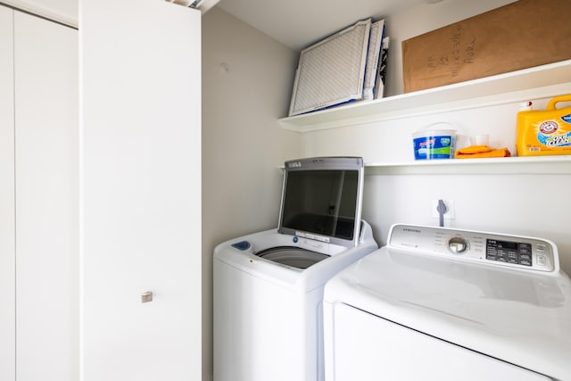 washroom with separate washer and dryer