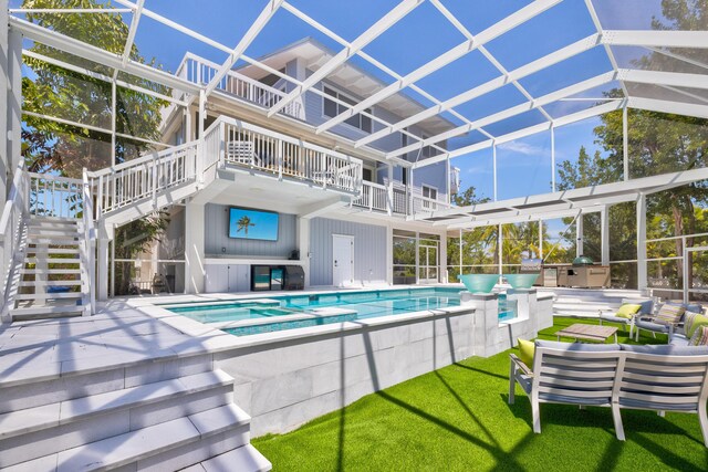 view of pool with an outdoor living space, an in ground hot tub, and a patio area