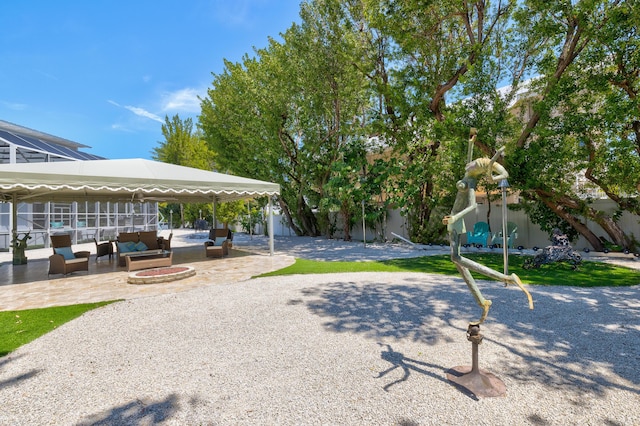 view of community featuring outdoor lounge area and a patio area