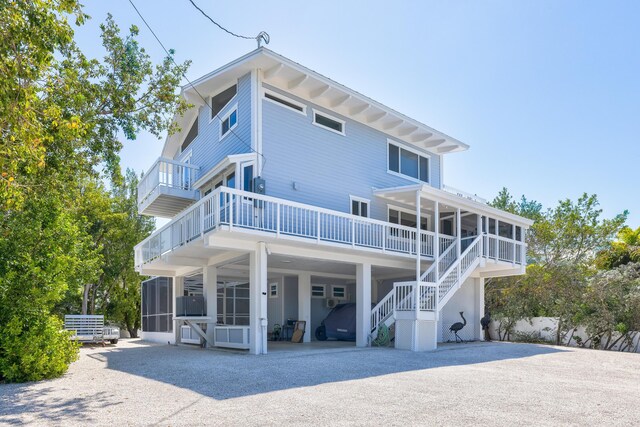 back of house with a sunroom and central air condition unit