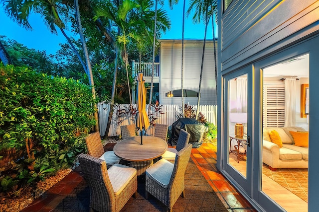 view of patio / terrace featuring french doors and a balcony