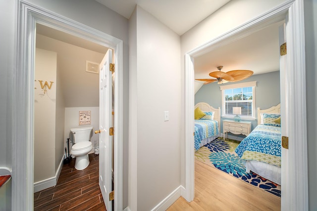 bedroom with lofted ceiling, dark wood-type flooring, and ceiling fan